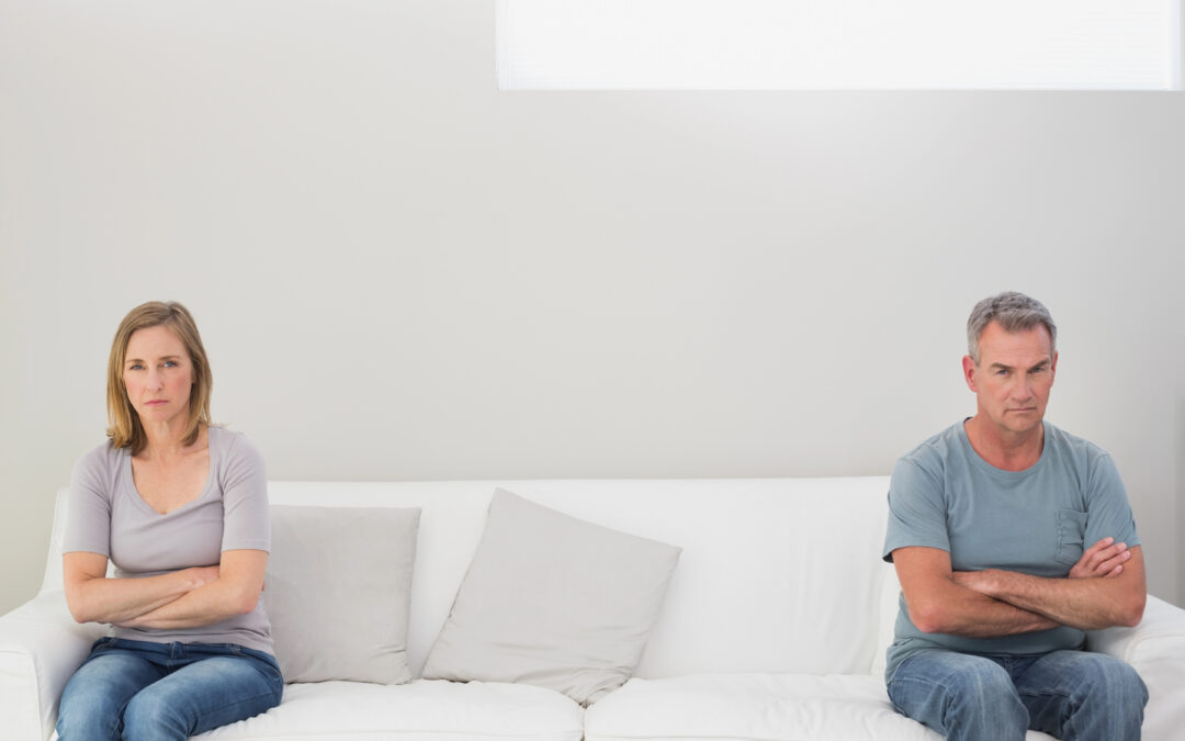 unhappy couple on couch